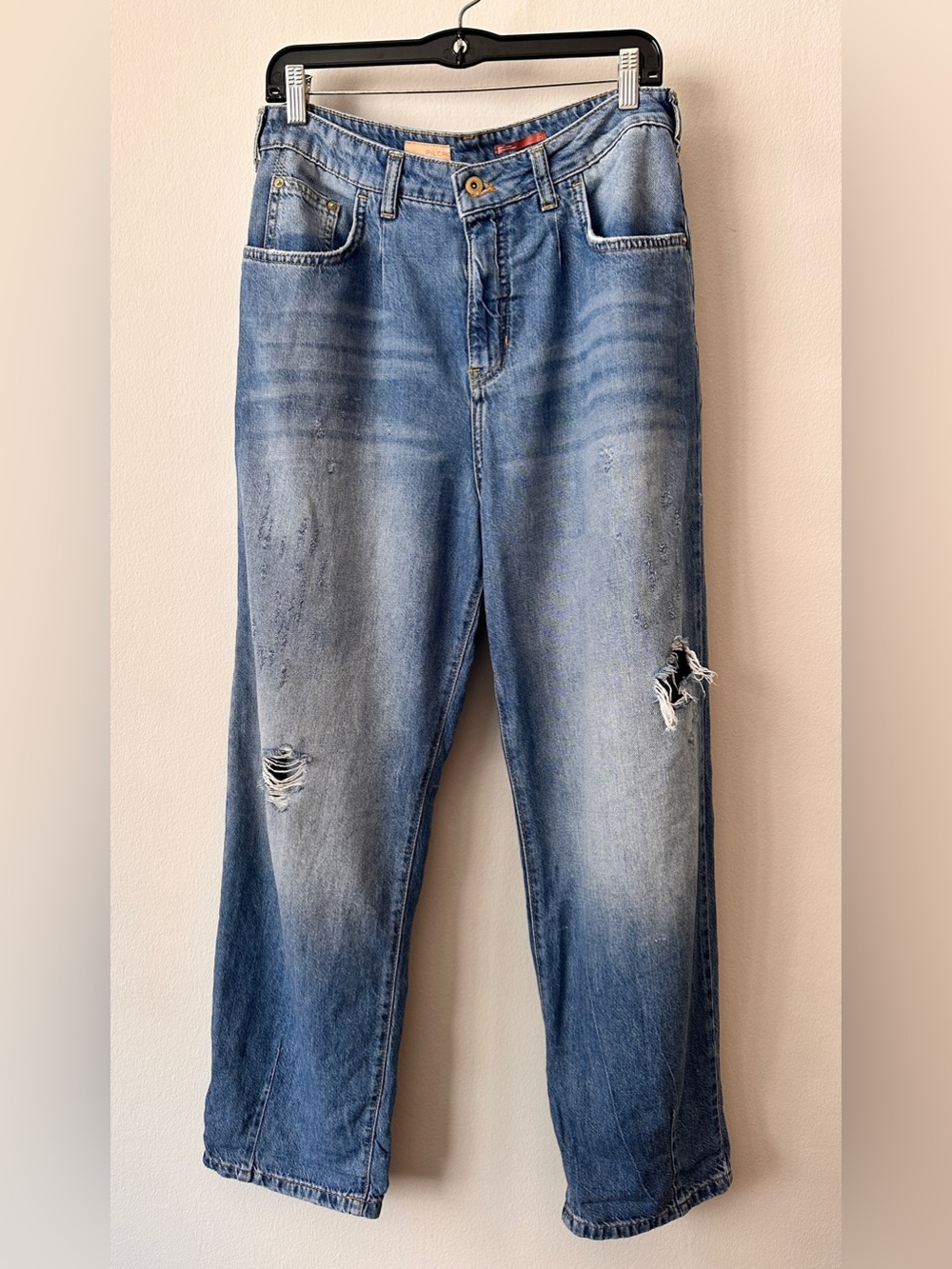 Anthropologie Pilcro Lt Blue Relaxed Jeans with distressed knees.